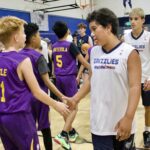 Youth basketball players shaking hands after a game.