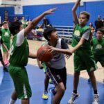 Young basketball players in action during a game.