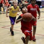 Young basketball players in action during a game.